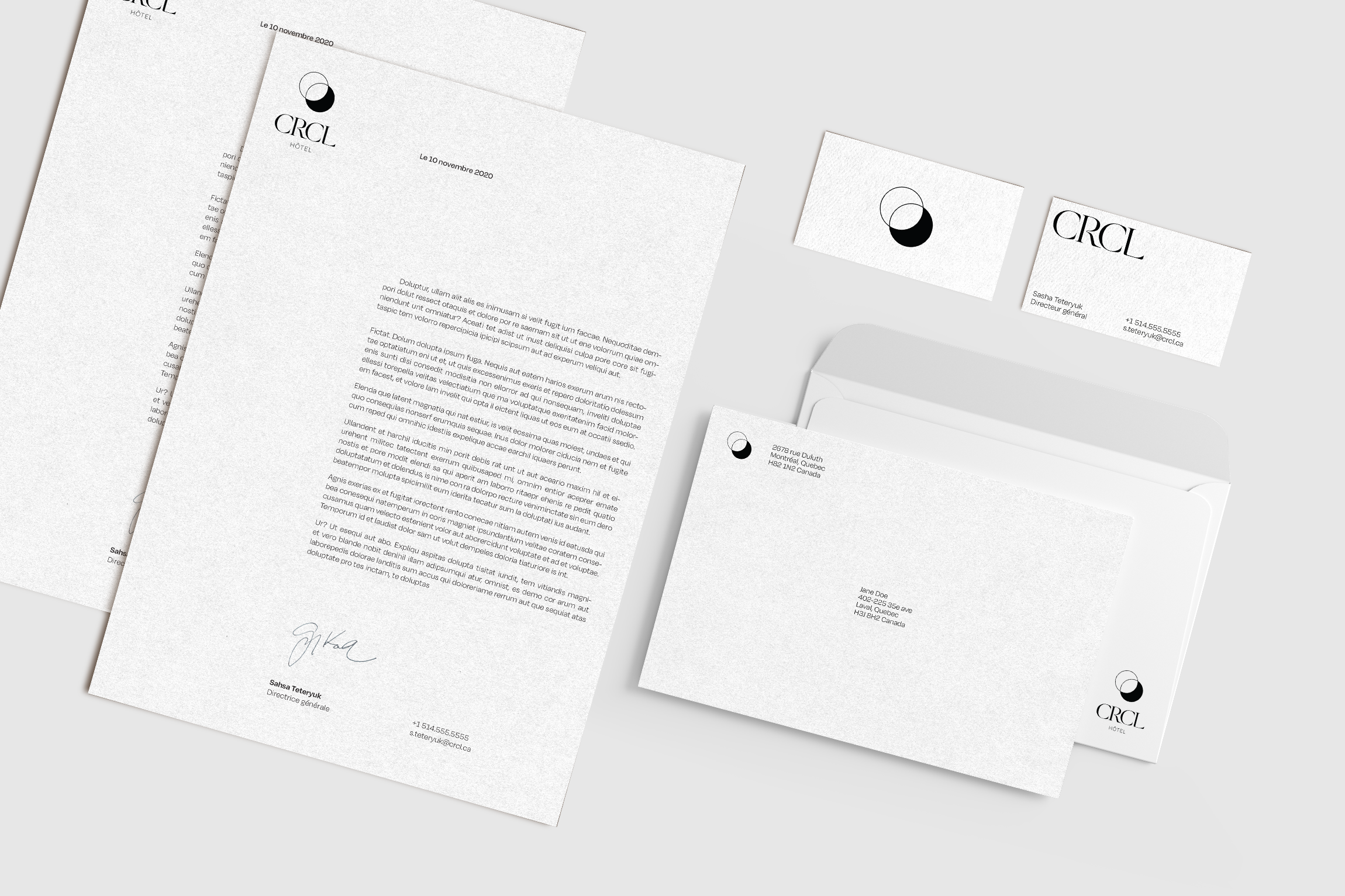 Mockup of paper stationary for the CRCL hotel, showing letterheads, envelopes and business cards.